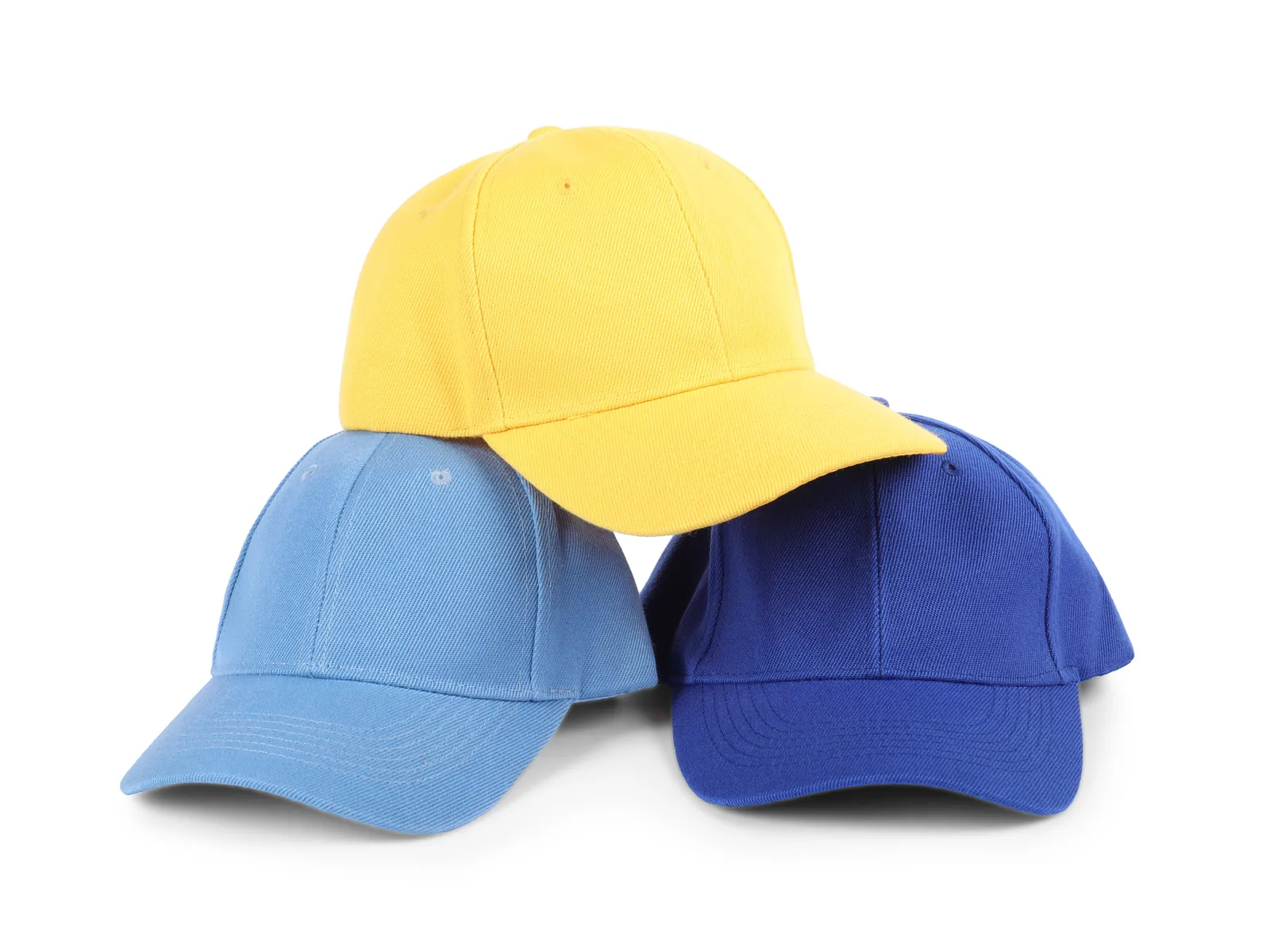 Three baseball caps in different colors ready for custom embroidery